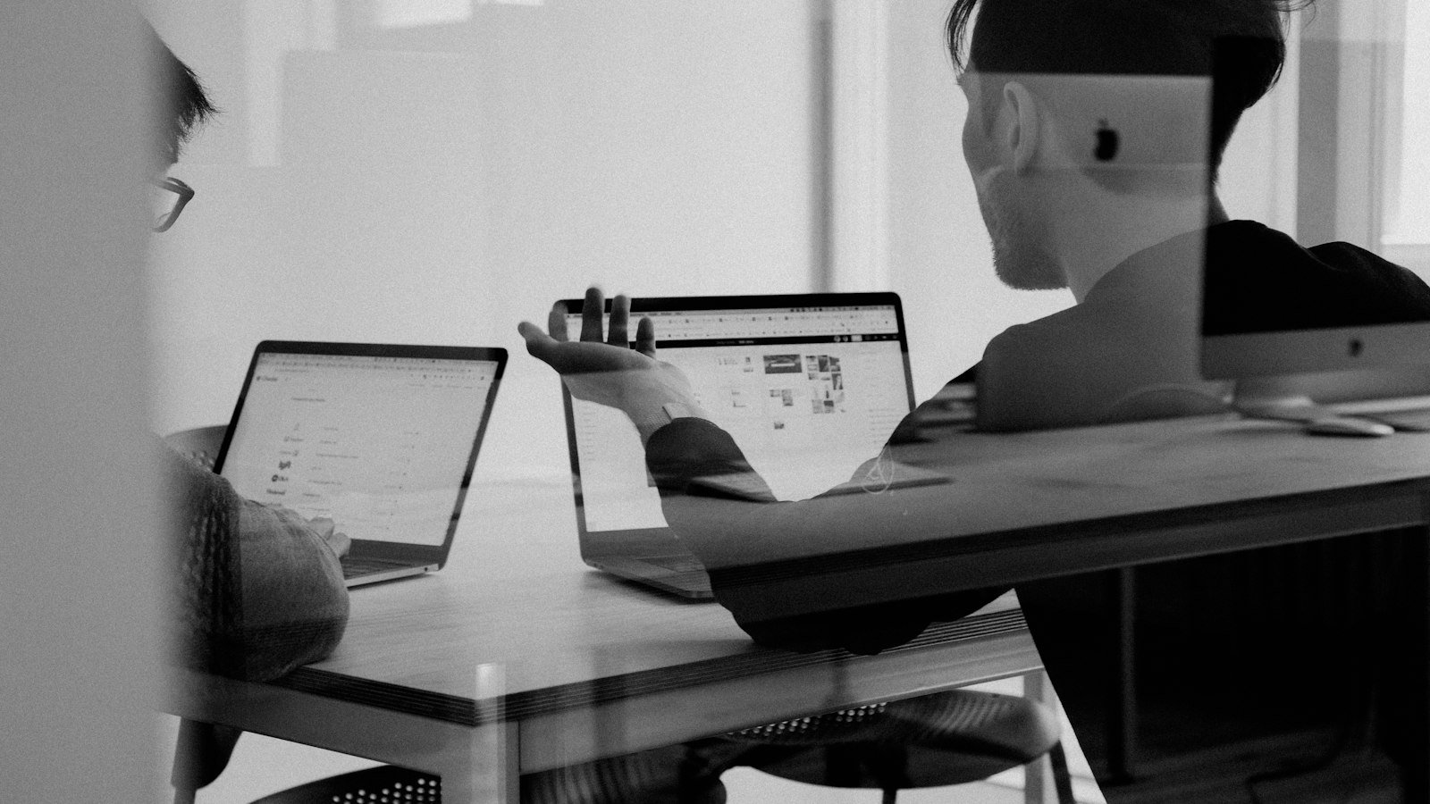 Person reviewing information on a laptop at a desk