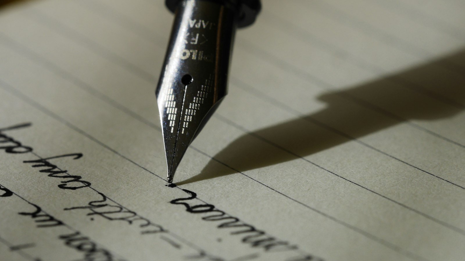 Fountain pen writing on lined paper
