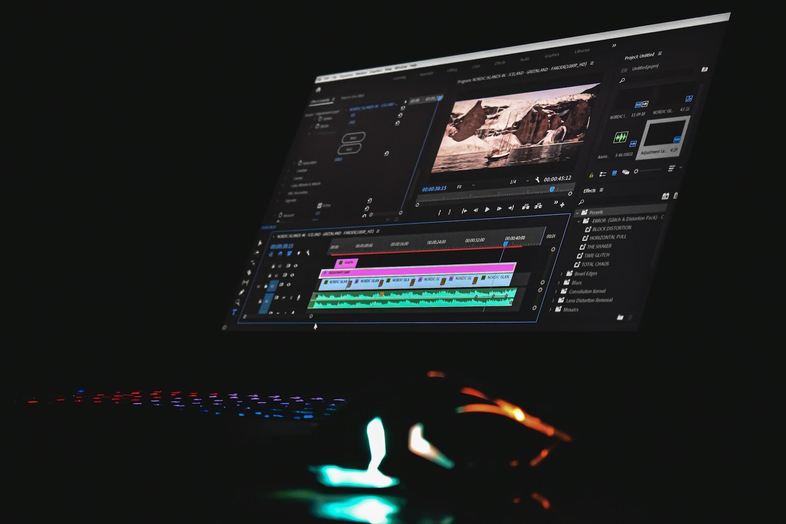 Computer monitor showing video editing software with a timeline and preview window
